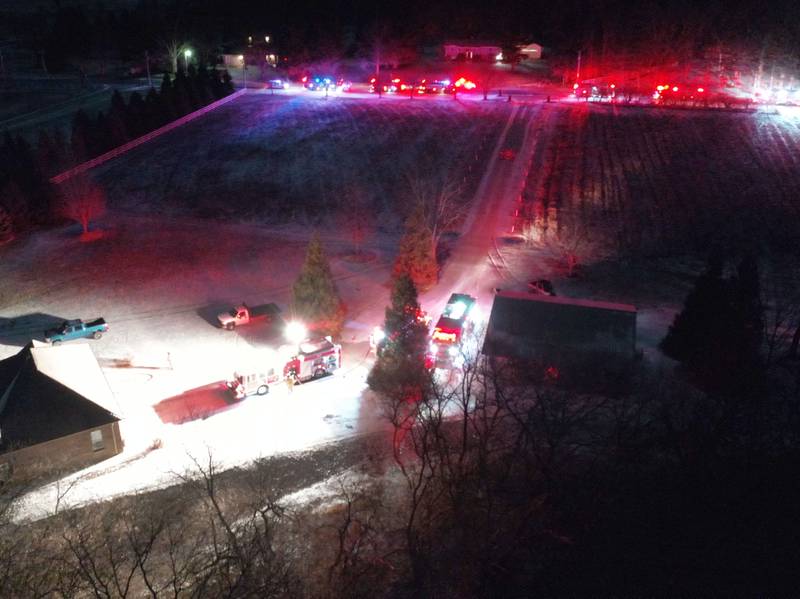 Firefighters respond to the scene of a structure fire in the 3000 block of East 550th Road on Saturday, Jan. 31, 2026 in Mendota. The fire started in the chimney area. Fire departments from Troy Grove, Utica, La Salle, Peru, Mendota and others across the region were dispatched shortly after 10p.m.