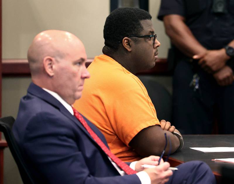 Timothy Doll, who pleaded guilty to murdering DeKalb High School freshman Gracie Sasso-Cleveland in 2023, and his attorney Andrew Nickel, listen to Circuit Court Judge Philip Montgomery pronounced his sentence Thursday, Aug. 14, 2025, at the DeKalb County Courthouse in Sycamore. Doll was sentenced to 52 years in prison.
