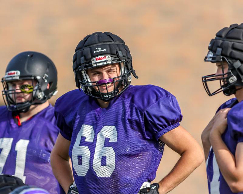 Rider Larson waits with teammates for the start of Plano High School football practice. Aug 20 2024.