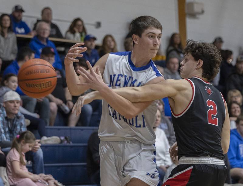 Newman’s Evan Bushman has the ball knocked away by Hall’s Gianni Guerrini Friday, Feb. 2, 2024 at Newman High School.