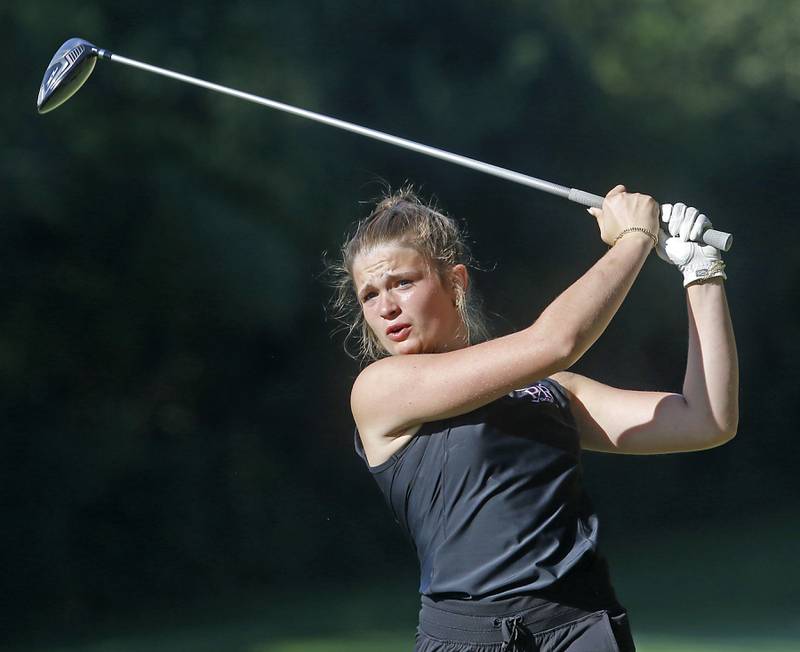 Prairie Ridge’s Lily Myers watches her tee shot on the 5th hole during the Fox Valley Conference Girls Golf Tournament Wednesday, Sept. 25, 2024, at Crystal Woods Golf Club in Woodstock.