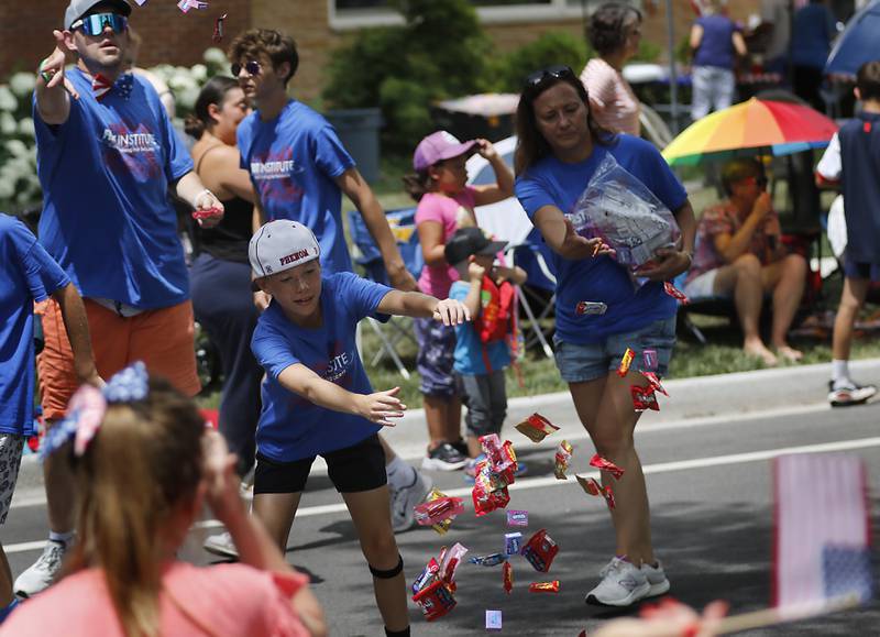 Candy is tossed on Sunday, July 6, 2024, during Crystal Lake’s annual Independence Day Parade on Dole Avenue in Crystal Lake.