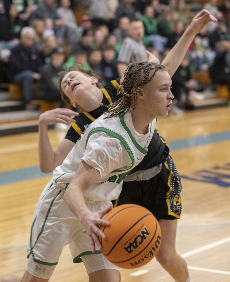 Rock Falls’ Nehemiah Menendez drives the baseline against Riverdale’s Paxton Kiddoo Friday, Feb. 28, 2025, during the Class 2A Regional final at Bureau Valley High School.