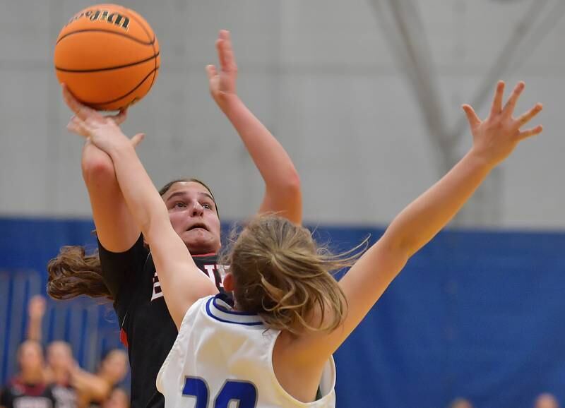 Benet's Aria Mazza is fouled as she puts up a shot against Lyons Township during a game on November 19, 2024 at Lyons Township High School in LaGrange.