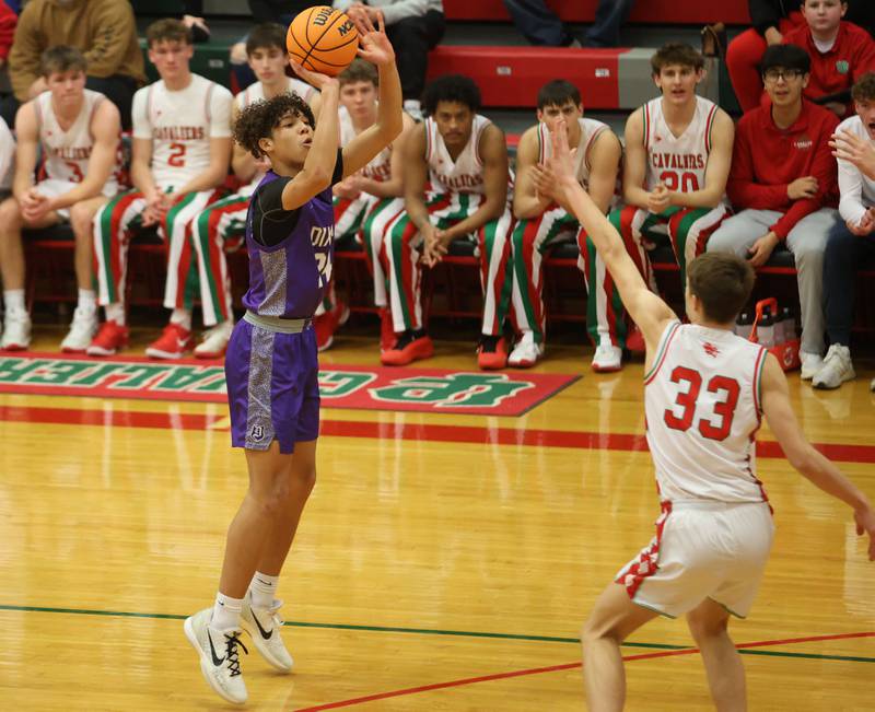 Dixon's Armahn McGowan fires a shot over L-P's Gavin Stokes on Tuesday, Jan. 20, 2026 in Sellett Gymnasium at L-P High School.