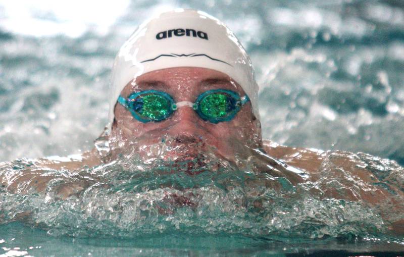 Kasparas Venslauskas of Cary-Grove co-op swims the breaststroke leg of the 200-Yard Medley Relay during the Fox Valley Conference Swimming Championships at Woodstock North High School Saturday.