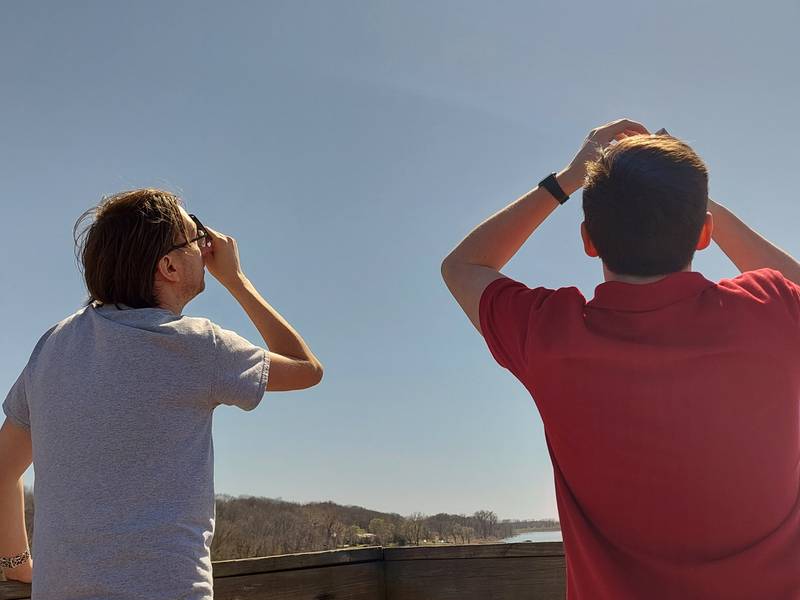 Residents viewed the partial solar eclipse Monday, April 8, 2024, from the top of the tower at the Dixon Waterfowl Refuge outside of Hennepin.