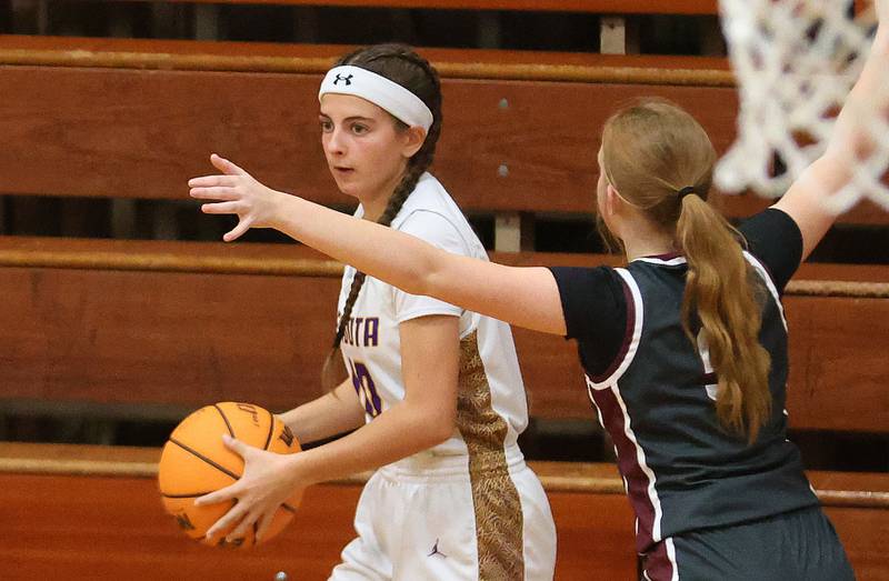 Mendota's Brooklyn Baxa looks to pass the ball around Illinois Valley Central's Taryn Johnigk during the Tiger Girls Basketball Holiday Tournament on Tuesday, Nov. 18, 2025 at Princeton High School.
