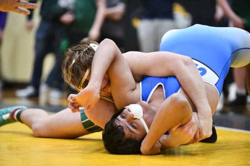 Bishop McNamara's Ethan Pfeiffer moves to pin Central-Iroquois West's Julian Martinez during Pfeiffer's 190-pound match vicitory on Saturday, Feb. 8, 2025, in the IHSA Class 1A Herscher regional.
