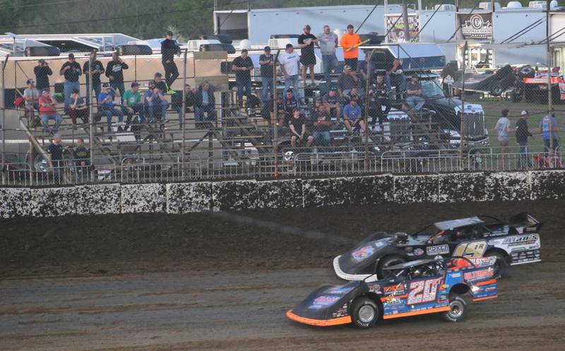 Racecars make the turn in front of fans during the season opening race on Tuesday, May 6, 2025 at La Salle Speedway.