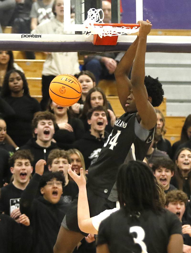 Kaneland's Jeffrey Hassan dunks the ball during the IHSA Class 3A Rochelle Sectional championship basketball game against Crystal Lake South on Friday, March 7, 2025, at Rochelle High School.