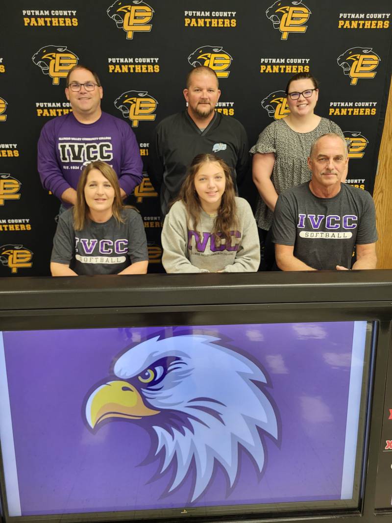 Putnam County senior Kylee Moore recently signed to play softball at IVCC. She was joined at her signing by her parents (front), Kari Moore and Kevin Moore (dad); and (back row) Cory Tomasson (IVCC head coach), Dusty Freeman (Starved Rock Bandits travel softball) and Angie Heiser (former PCHS softball coach).