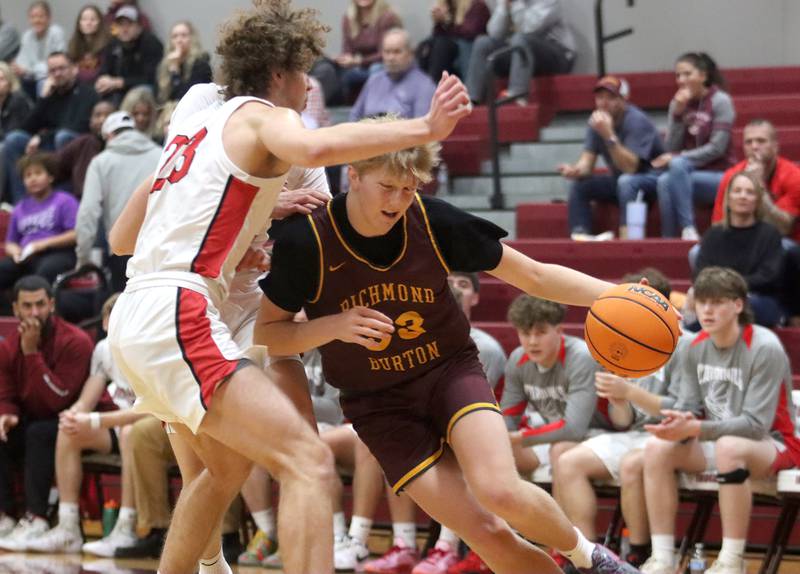 Richmond-Burton’s Luke Robinson fights his way to the hoop against Stillman Valley during 74th Annual E.C. Nichols Holiday Classic varsity boys basketball tournament action on Saturday, Dec. 28, 2024 at Marengo High School in Marengo.
