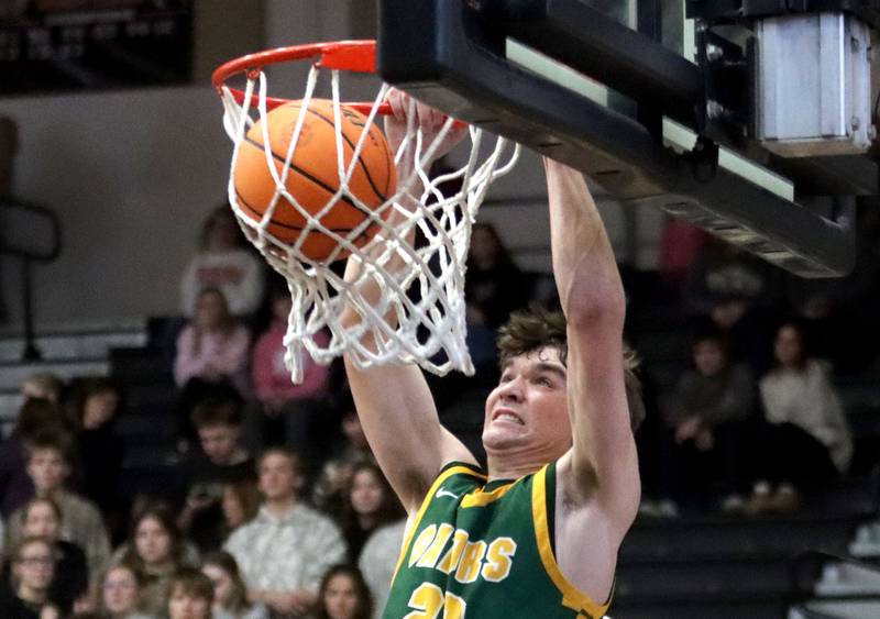 Crystal Lake South’s Nick Stowasser slams the ball for a dunk in varsity boys basketball on Friday, Feb. 20, 2026, at McHenry High School in McHenry.