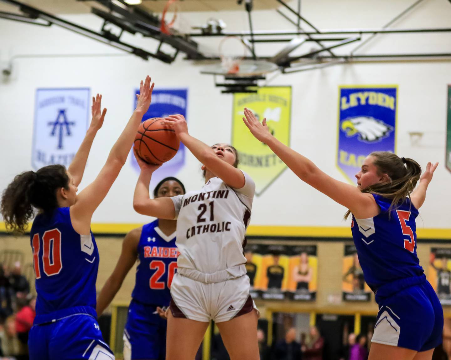 Montini Catholic's Alyssa Epps (21) puts up a shot during Class 3A Hinsdale South Regional final game between Glenbard South at Montini Catholic.  Feb 17, 2023.