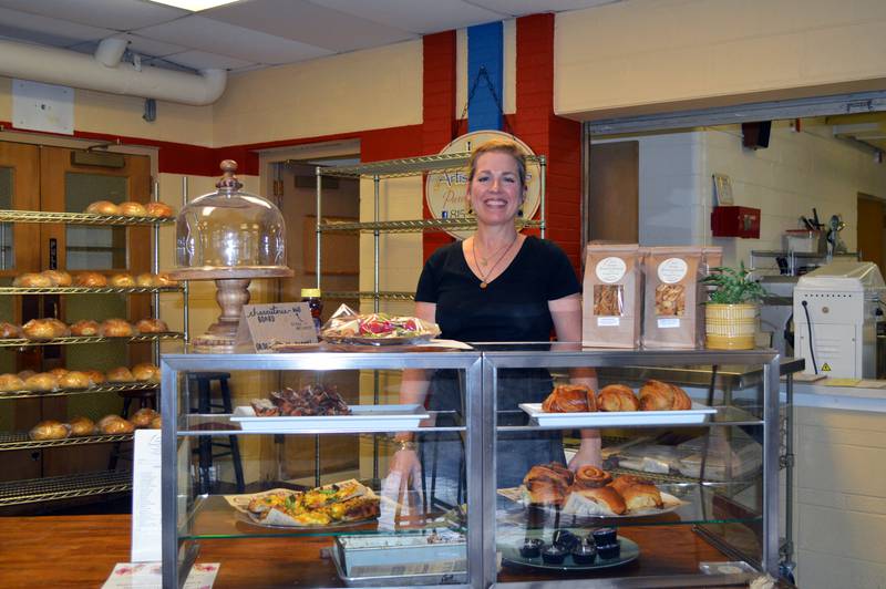 Jen's Artisan Breads owner Jen Koertner poses for a photo in her bakery on Friday, Feb. 16, 2024. The business is located in the former David L. Rahn Junior High School in Mount Morris.