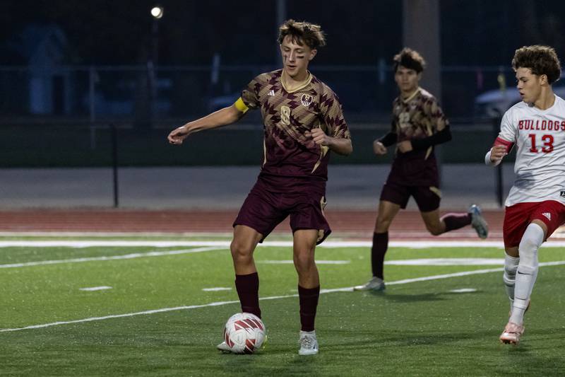 Morris's Griffyn Cowell takes control of the ball during a varsity soccer game against Streator at Morris on Oct. 15, 2025.