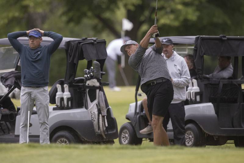Baley Lehr tees off while other players watch during the Pine Hills golf tournament on Sunday, June 11, 2023 in Ottawa.