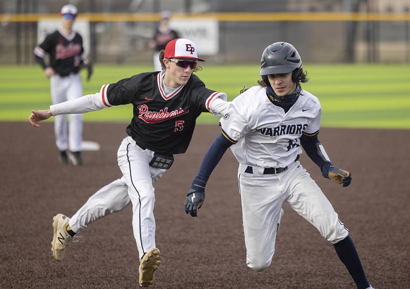 E-P’s Reece Duncan tags out Sterling’s Gio Cantu after getting him into a run down Wednesday, March 15, 2023.