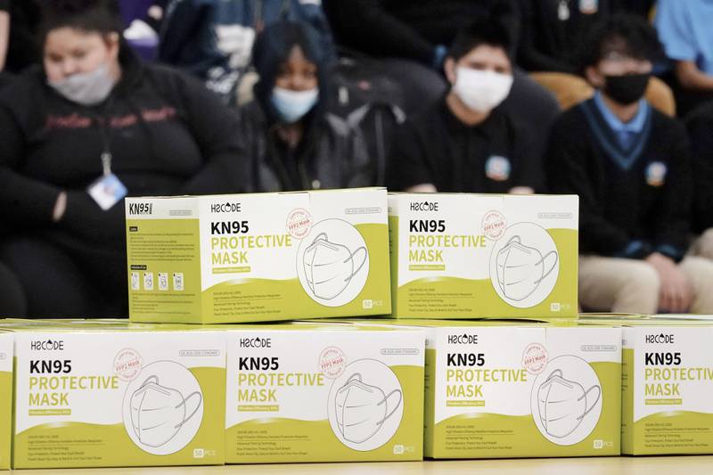 FILE - Boxes of KN95 protective masks are stacked together before being distributed to students at Camden High School in Camden, N.J., Wednesday, Feb. 9, 2022. According to a study by the Centers for Disease Control and Prevention released Tuesday, April 26, 2022,  three out of every four U.S. children have been infected with COVID-19. (AP Photo/Matt Rourke, File)