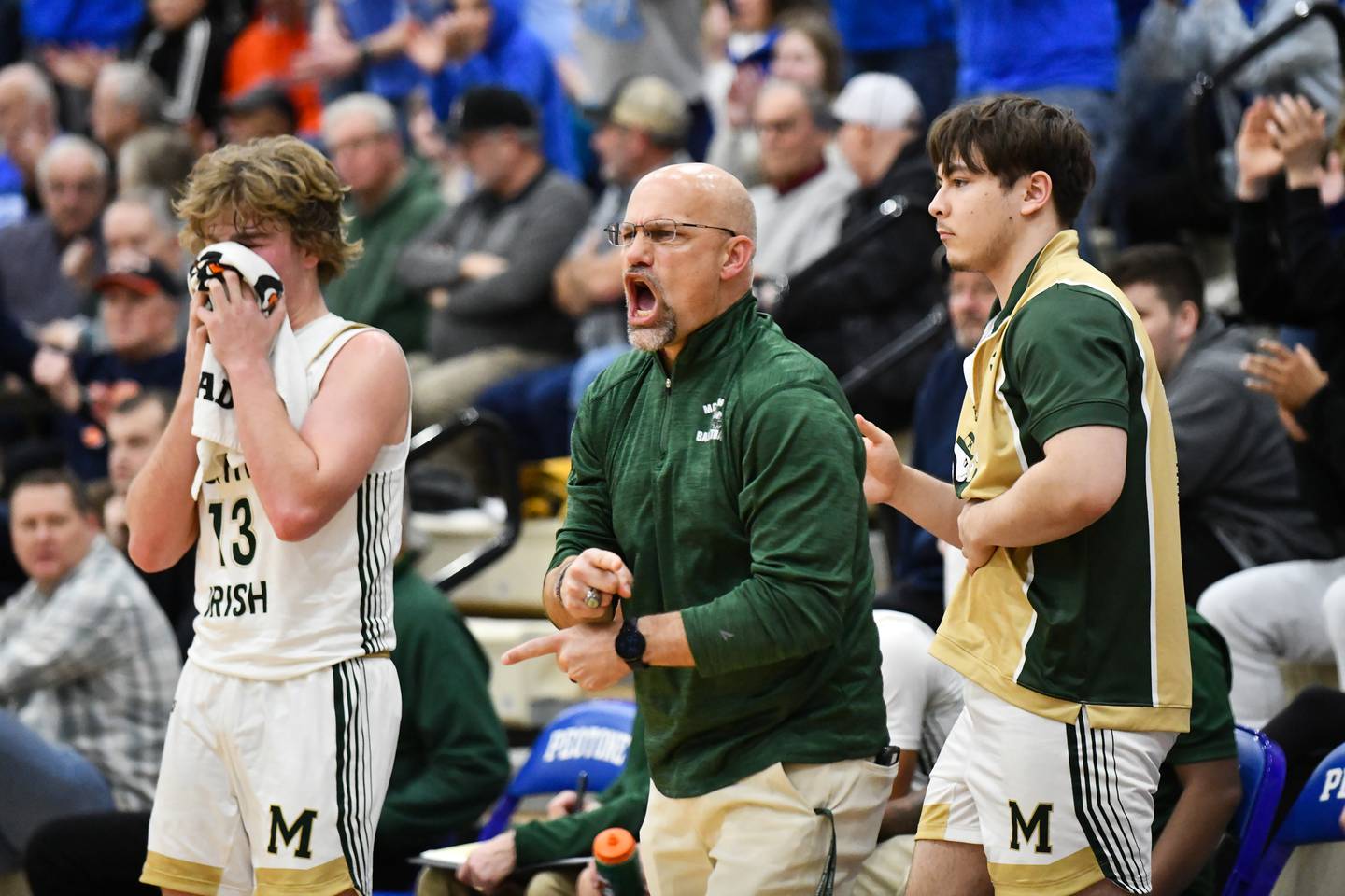 Bishop McNamara head coach Adrian Provost yells to his players during the Fightin' Irish's 52-49 loss in the IHSA Class 2A Peotone Sectional championship on Friday, March 7, 2025.
