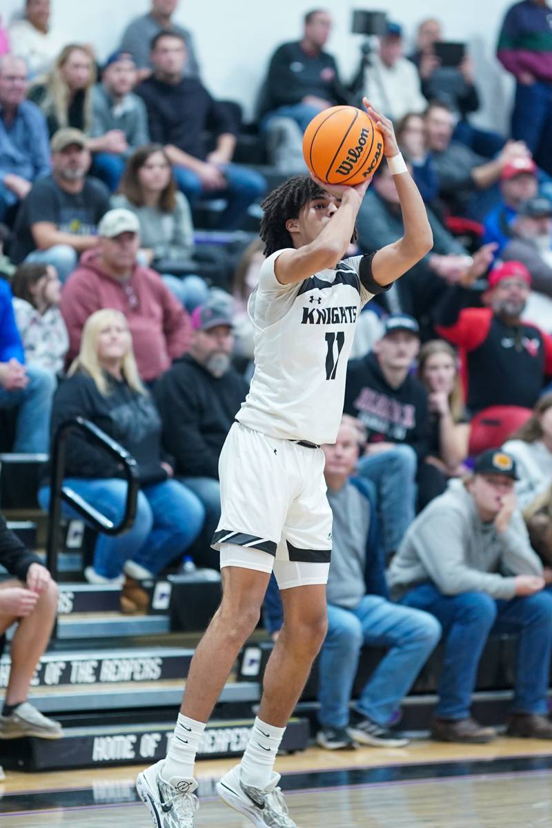 Kaneland’s Evan Frieders (11) shoots a three pointer against Streator during a semi-final basketball game in the 61st annual Plano Christmas Classic at Plano High School on Friday, December 27, 2024.