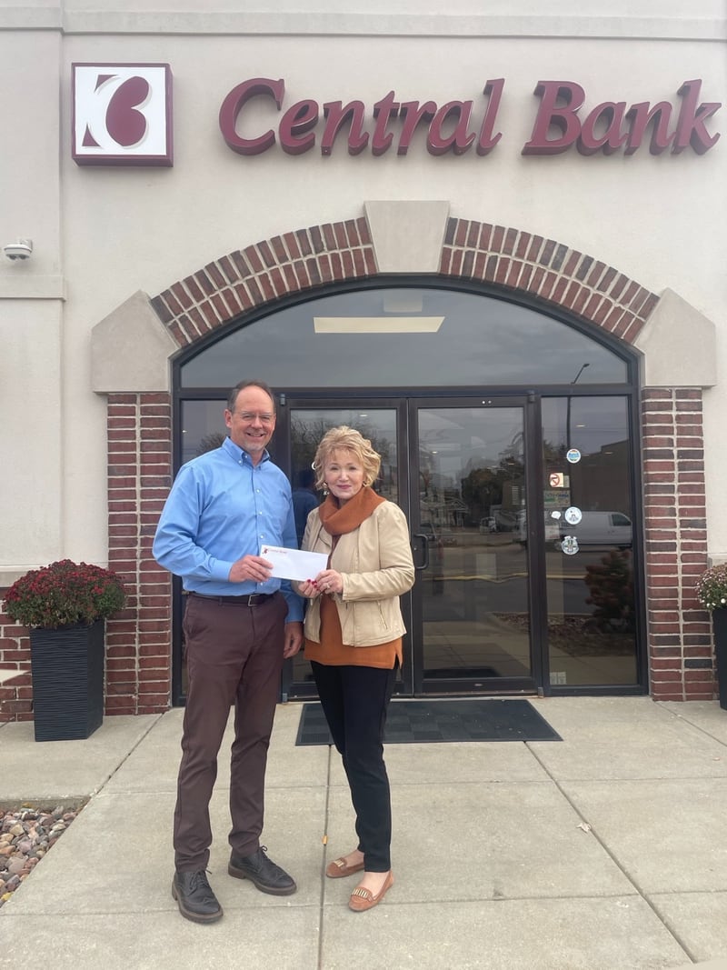 CBI Community Bank President Jeff Hunt presents Princeton Foundation Community Director Sue Stutzke with an inaugural donation.
