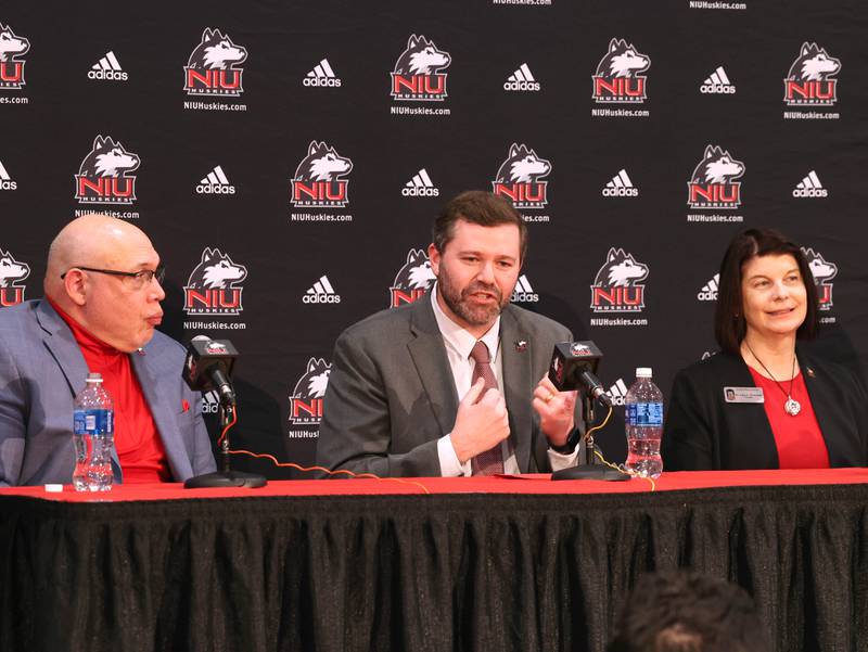 New Northern Illinois University men’s head basketball coach Matt Majkrzak answers questions while flanked by NIU Vice President/Director of Athletics and Recreation, Sean Frazier, (left) and university president Lisa Freeman Tuesday, March 24, 2026, during a press conference to introduce Majkrzak in the Convocation Center at NIU in DeKalb.