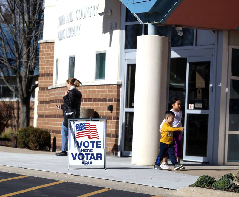 People leave the Town and Country Public Library polling place in Elburn on Tuesday, Nov. 8, 2022.