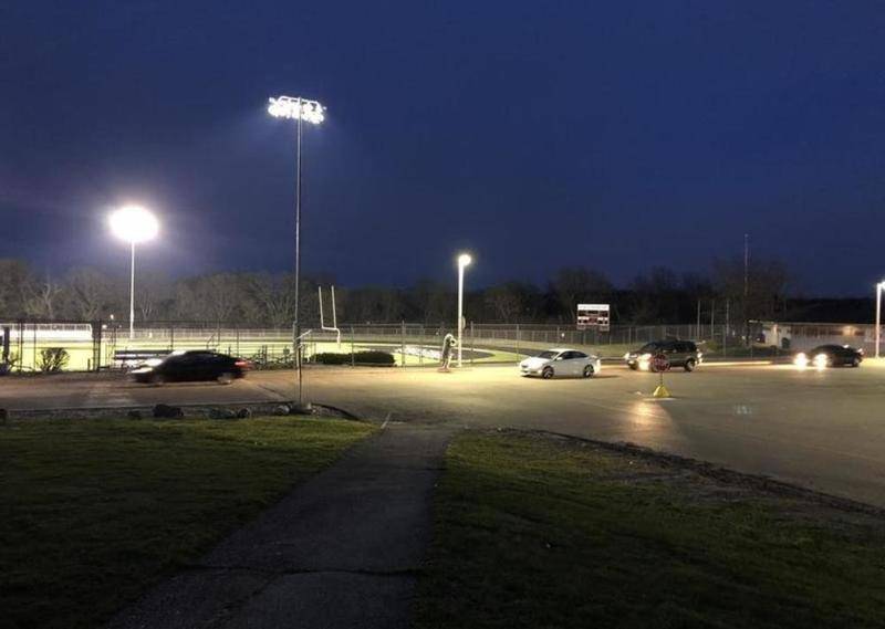 Stadium lights illuminate Prairie Ridge High School's football field as Community High School District 155 participates in a parade around the fields at PR and Cary-Grove High School to show school spirit during the coronavirus pandemic. The district plans to do the same thing to honor seniors, as it recently announced it will reschedule its formal graduation ceremony.