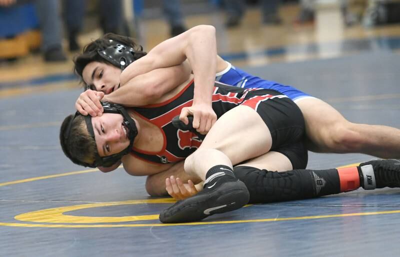 Amboy's Levi Near (bottom) wrestles Princeton's Ace Christiansen in the third-place match at 132 pounds at the 1A Polo Wrestling Regional held at Eastland High School in Lanark on Saturday, Feb. 4.