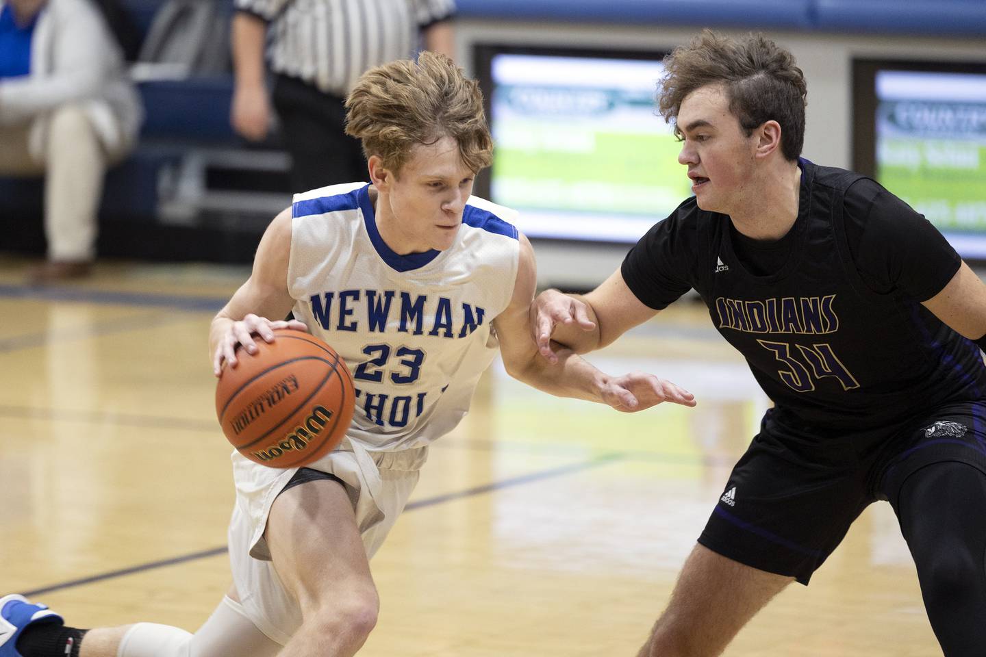 Newman’s Lucas Simpson drives to the hoop Tuesday, Dec. 13, 2022 against Pecatonica’s Korbin Gann.