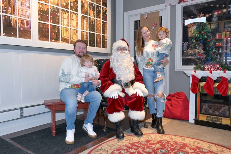 The Dubsky family , Andrew, JD, 18mo, Josephine and AJ, 2 from St. Charles visit Santa at the Geneva Visitor Center on Saturday, Dec 20, 2025 in Geneva.