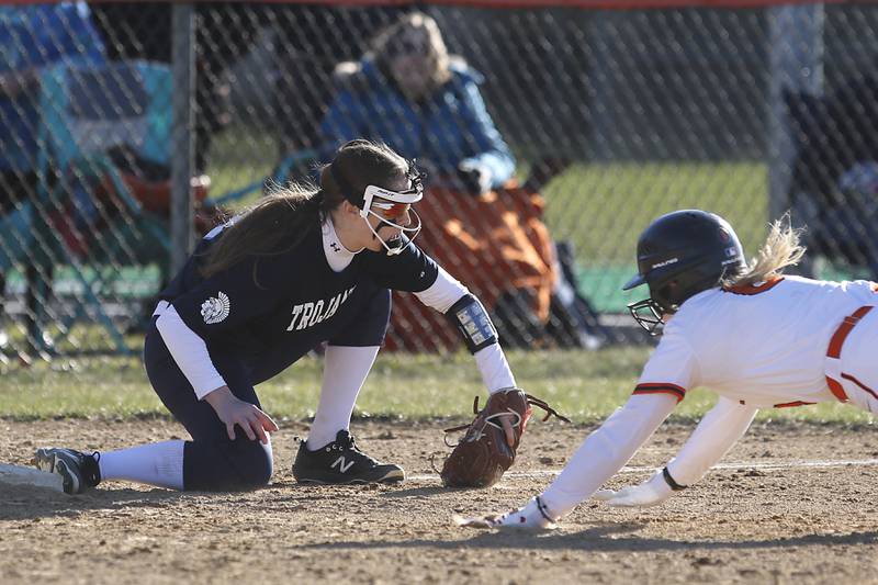 Crystal Lake Central’s Giada Motto dives into third base as Cary-Grove’s Grace Kaiser wait4es for the throw during a Fox Valley Conference softball game Thursday, April 6, 2023, at Crystal Lake Central High School.