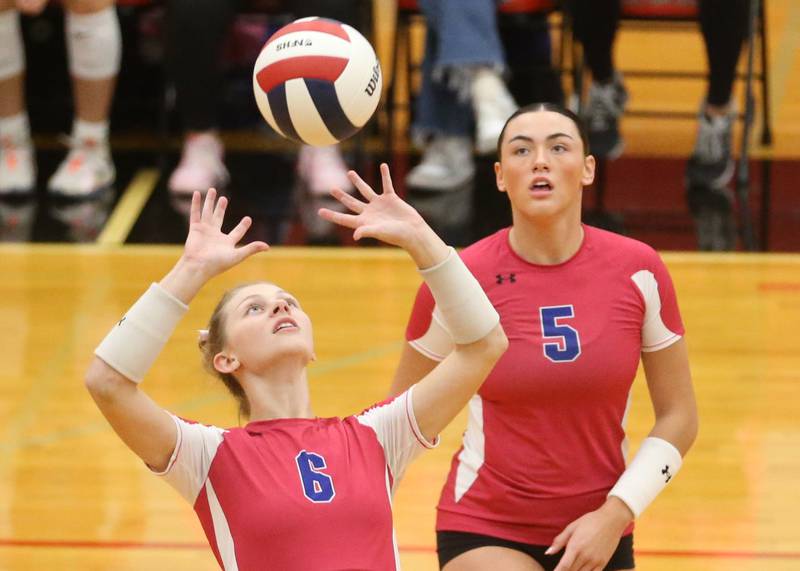Princeton's Caroline Keutzer sets the ball in the air as teammate Keely Lawson watches from behind on Thursday, Oct. 9, 2025 at Hall High School.