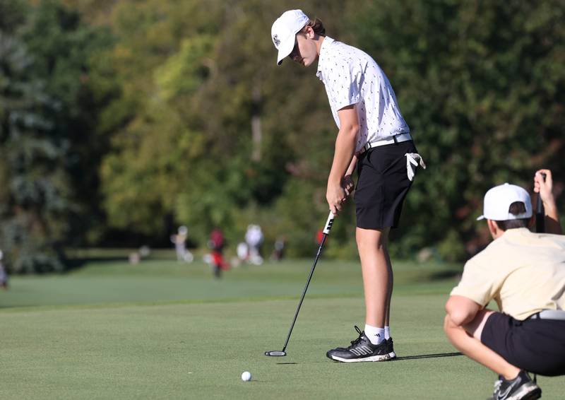 Kaneland’s Jack Frey putts on the third green Monday, Sept. 23, 2024, during the Interstate 8 boys golf tournament at the Kishwaukee Country Club in DeKalb.