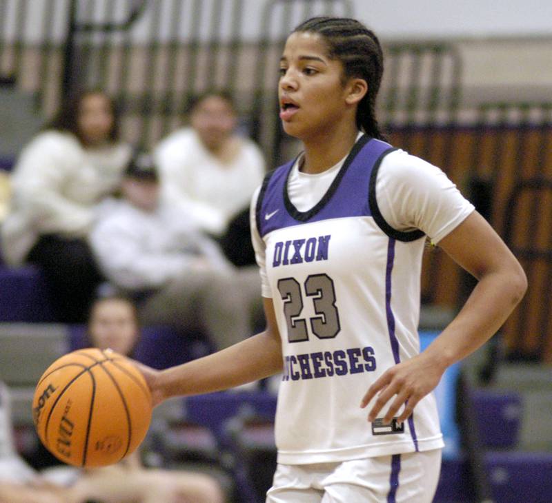 Dixon's Ahmyrie McGowan brings the ball up court. The Dixon Duchesses played  the Aurora Central Catholic Chargers in the Dixon Holiday Tournament
at Dixon High School on Friday, December 26th, 2025