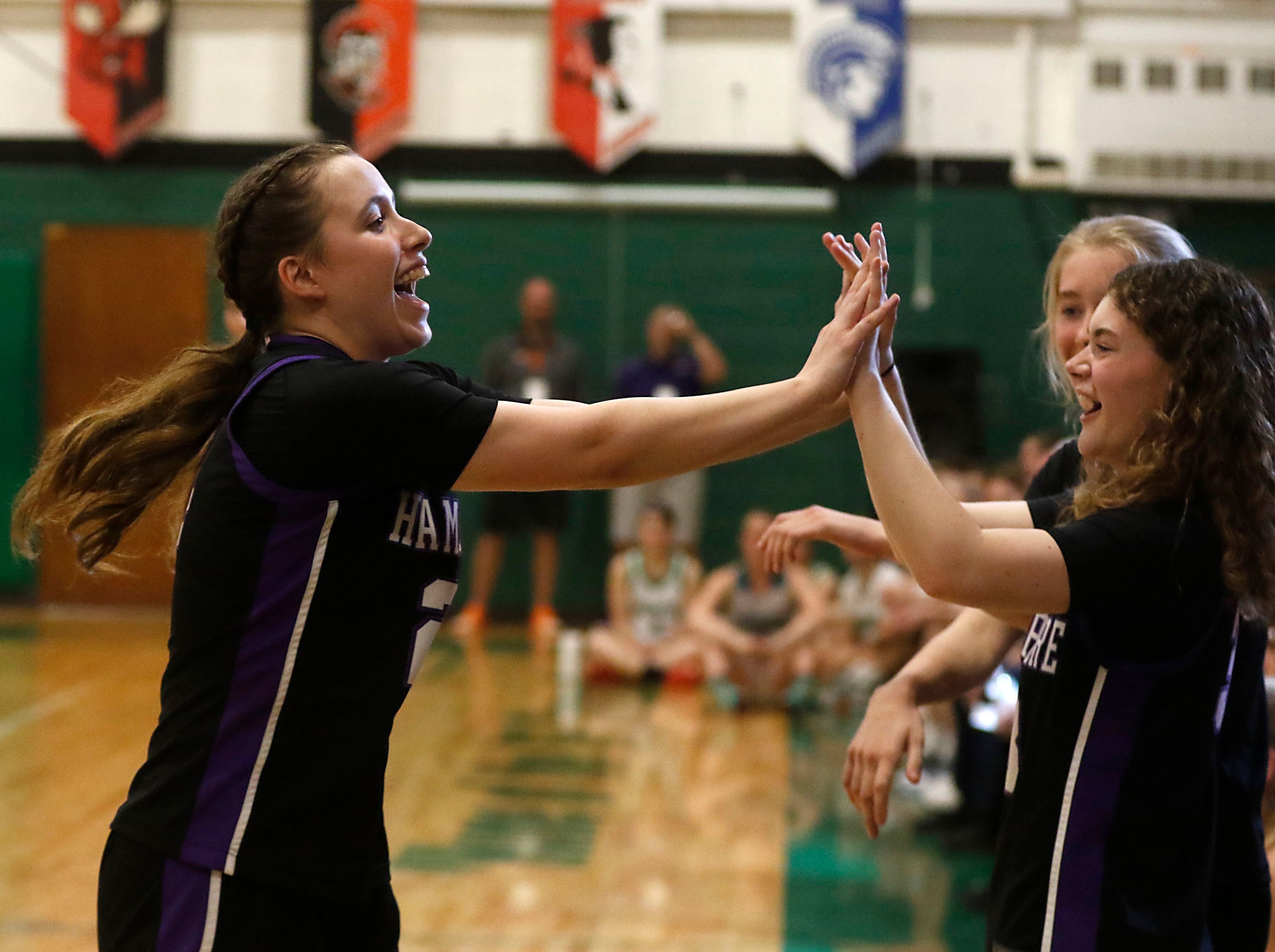 Hampshire's Whitney Thompson high fives here teammates after winning the girl’s three-point contest of McHenry County Area All-Star Basketball Extravaganza on Sunday, April 14, 2024, at Alden-Hebron’s Tigard Gymnasium in Hebron.