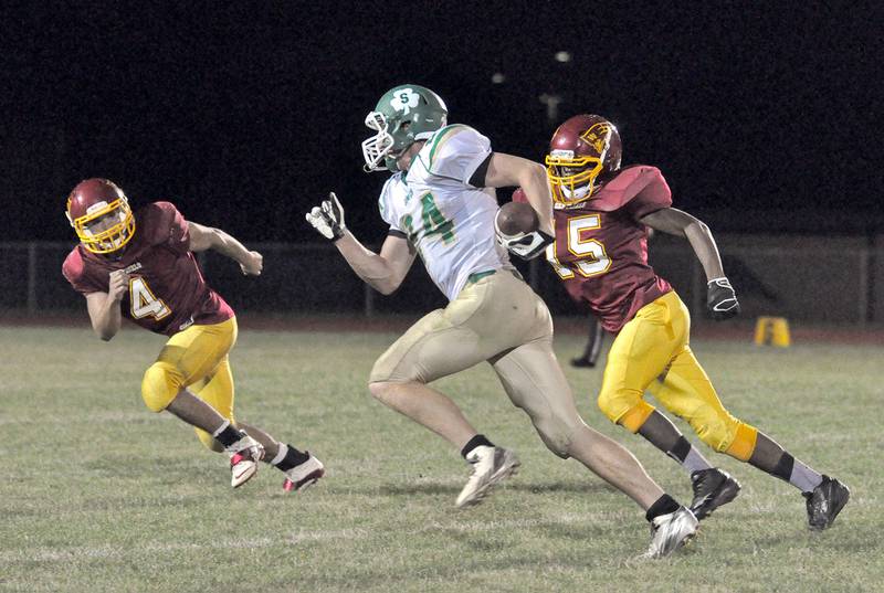 Westmont's Montraveous Little (15) and Tim Doll (4) pursue Seneca's Austin Applebee in this 2013 file photo. The Sentinels and Fighting Irish, then both members of the Interstate 8 Conference, will be renewing their conference rivalry this coming fall as members of the new Chicago Prairie Football League.