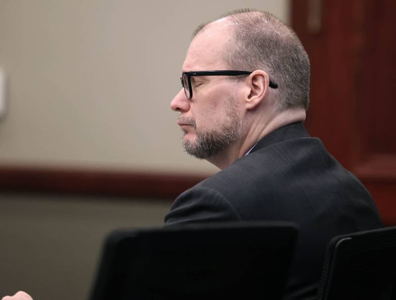 Jonathan D. Hurst closes his eyes as he listens to his brother Craig Hurst, of Indiana, testify on his behalf Thursday, Jan. 30, 2025, during day six of his trial at the DeKalb County Courthouse in Sycamore. Hurst is charged in the 2016 killings of elderly mother and son Patricia and Robert Wilson in Sycamore.