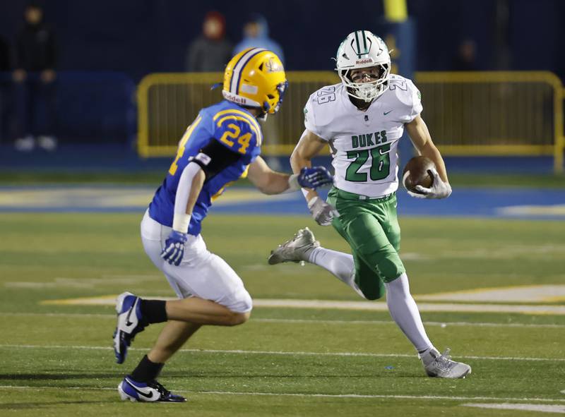 York's Henry Duda (26) runs the ball against Lyons during the varsity football first-round 8A playoff game between York and Lyons Township on Friday, Oct. 31, 2025 in Western Springs, IL.