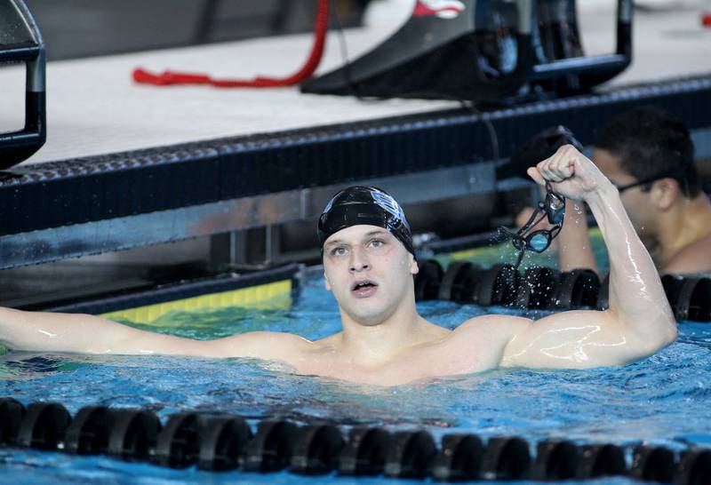 St. Charles North’s Aleksej Filipovic celebrates his win in the championship heat of the 200-yard individual medley during the IHSA Boys Swimming and Diving Championships at FMC Natatorium in Westmont on Saturday, Feb. 26. 2022.