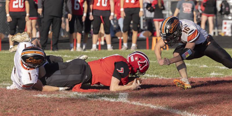 Amboy’s Tanner Welch is hit on the ground by Milledgeville’s Caleb Sarber Saturday, Nov. 15, 2025, in the 8-man football semifinal. Sarber was called for a late hit.