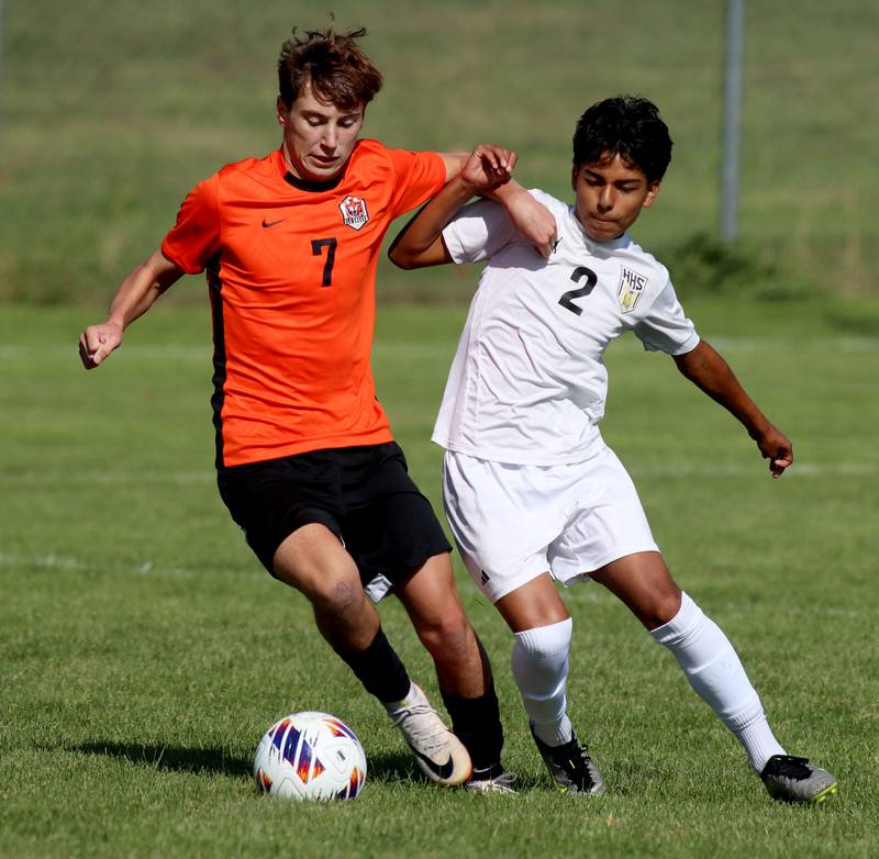 Crystal Lake Central’s Nathan Gray, lett, battles Harvard’s Eddie Fuentes in varsity boys soccer at Crystal Lake Central High School in Crystal Lake on Saturday, Sept. 6, 2025.