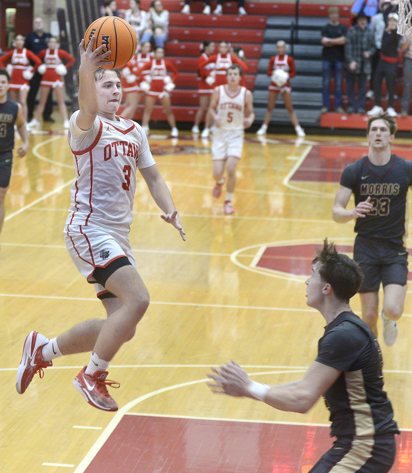 Ottawa’s Connor diederich goes up and over Morris’s Brett Bounds to score in the 1st period Tuesday at Ottawa.