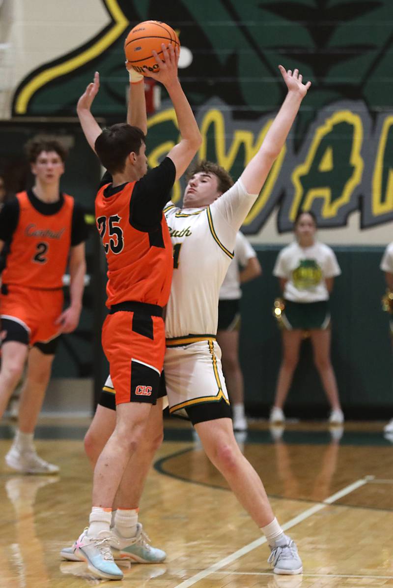 Crystal Lake Central's Aidan Watson looks to pass as he is closely guarded by Crystal Lake South's Ryan Morgan during an IHSA Class 3A Crystal Lake South Regional boys basketball semifinal game on Wednesday, February, 25, 2026, at Crystal Lake South High School.