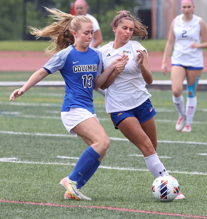 Johnsburg's Lauren McQuiston (right) and Columbia's Riley Mathews battle for possession Saturday, June 7, 2025, during the IHSA Class 1A state championship game at North Central College in Naperville.