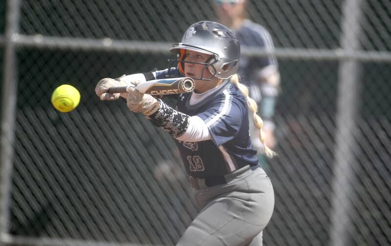 Oswego East’s Madye Greenwood bunts during a game at Waubonsie Valley on Friday, April 1, 2022.