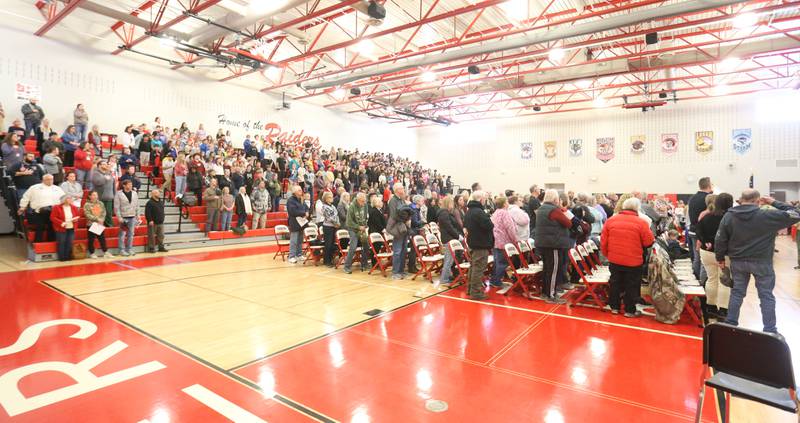 Veterans stand to be recognized as students and staff fill the gymnasium during the Veterans Day program on Tuesday, Nov. 11, 2025 at Parkside Middle School in Peru.