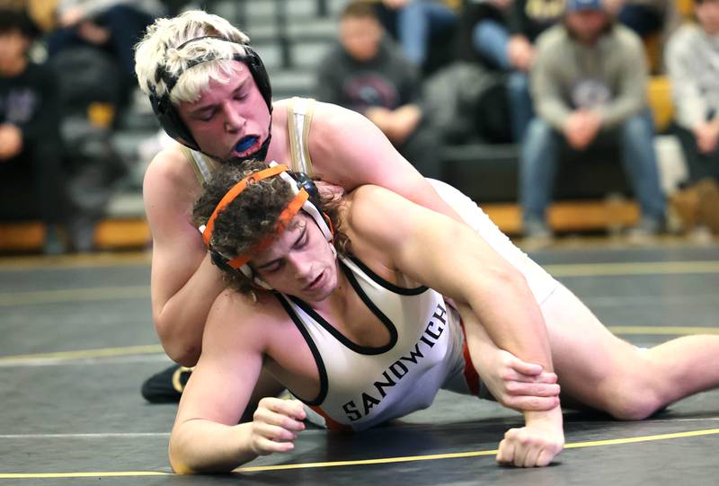 Sycamore’s Cooper Bode controls Sandwich’s Bryce Decker during their 170 pound championship match Saturday Jan. 21, 2023, during the Interstate 8 Conference wrestling tournament at Sycamore High School.